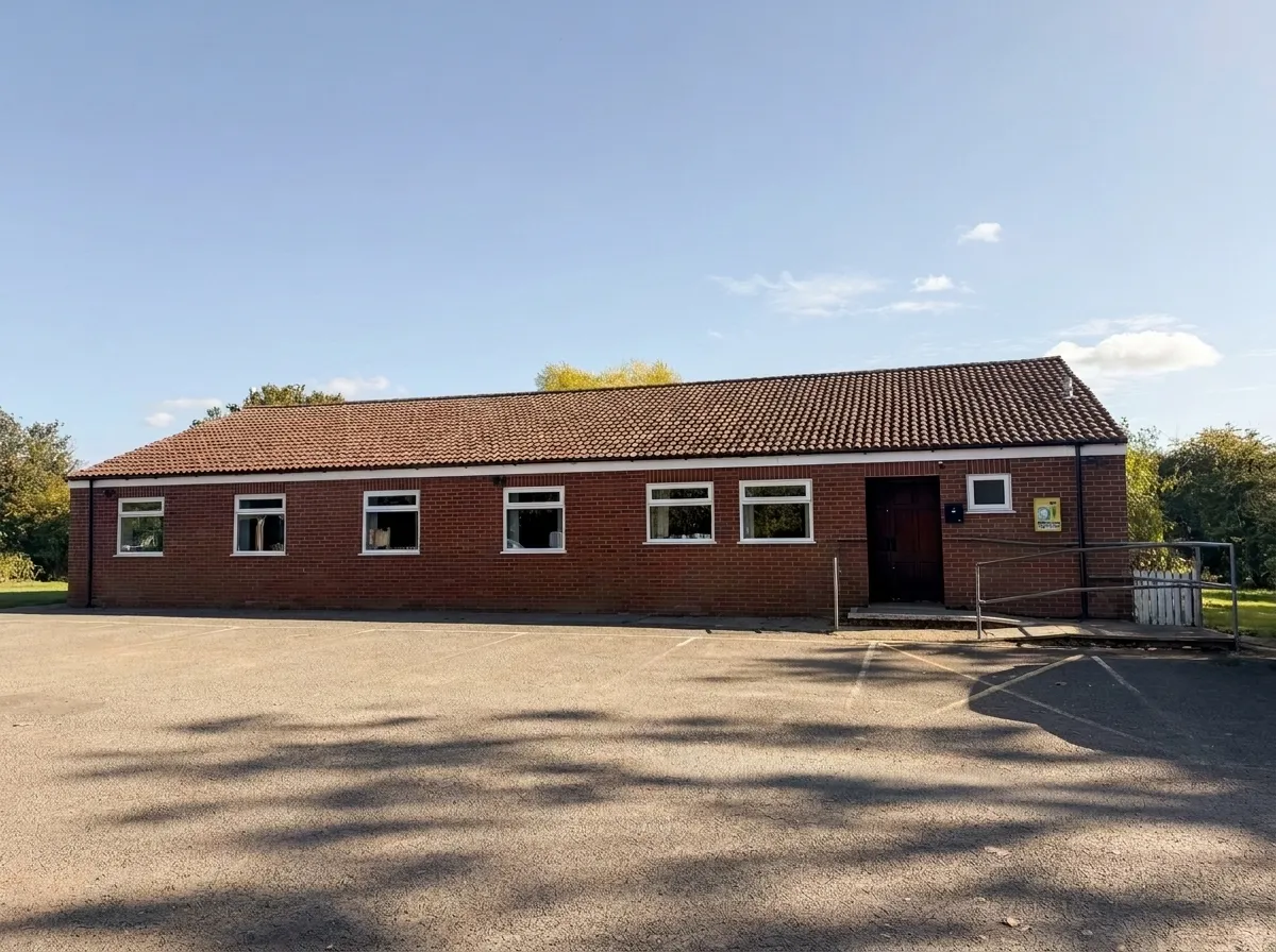 The outside of Barnham Broom Village Hall, where you arrive